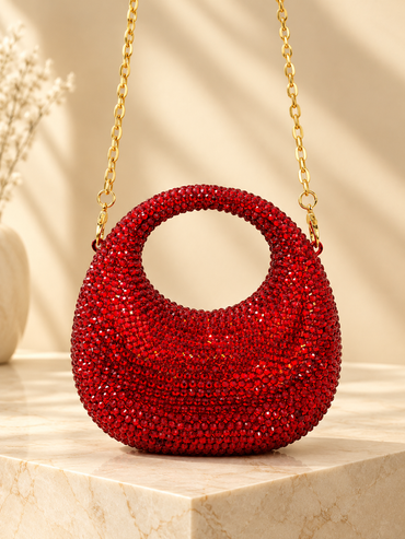 Red crystal-encrusted circular evening handbag with gold chain handle