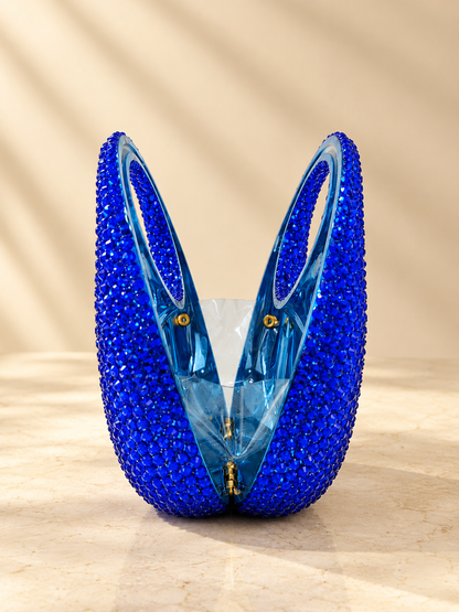 Blue crystal circular handbag with cut-glass style front and gold chain handles