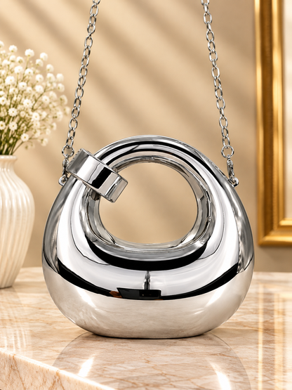 Silver metallic ring-loop evening handbag with silver chain strap and hinged handle