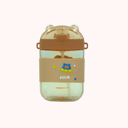 Kids water bottle with straw and strap, bear cartoon graphic, cream body with orange cap.