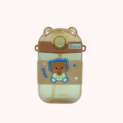 Kids water bottle with straw and strap, bear cartoon graphic, cream body with brown cap ears.