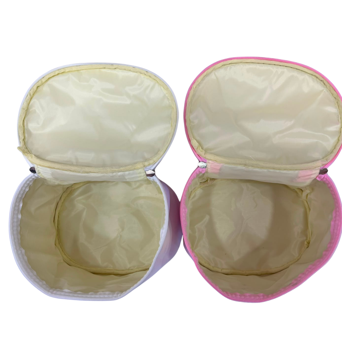 Pair of holographic cosmetic pouches, open to show pale interior and a bow applique
