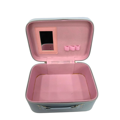 Open pink cosmetic vanity case with top handle, lined interior and front pocket