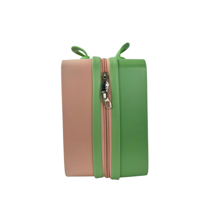 Dual-tone kids beauty storage box in brown and green with zipper front detail.