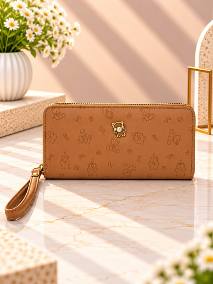 Camel brown zip-around wristlet wallet with debossed character pattern and wrist strap