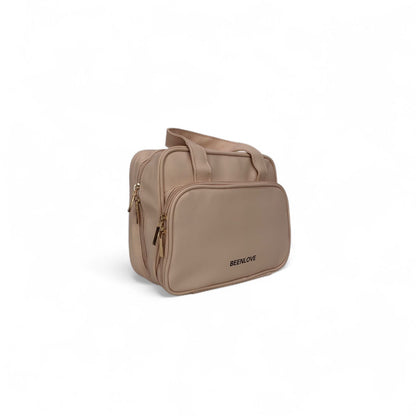 Beige travel vanity case with side zipper detail and top handle, BEELNOVE logo.
