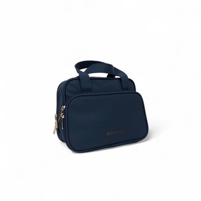 Navy travel vanity case with side zipper and top handle, BEELNOVE logo.