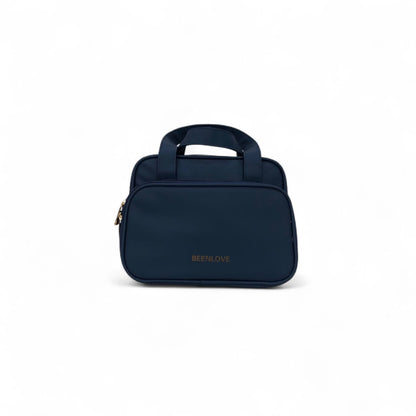 Navy travel vanity case with top handle and front zipper, BEELNOVE logo.