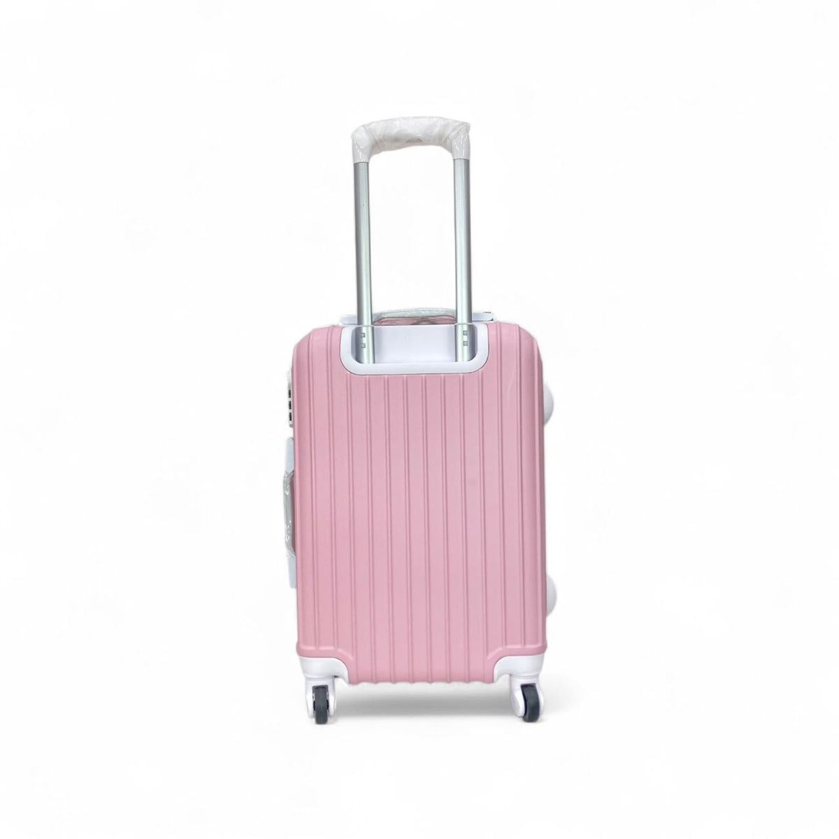 Pink spinner suitcase with rear handle and ribbed shell texture