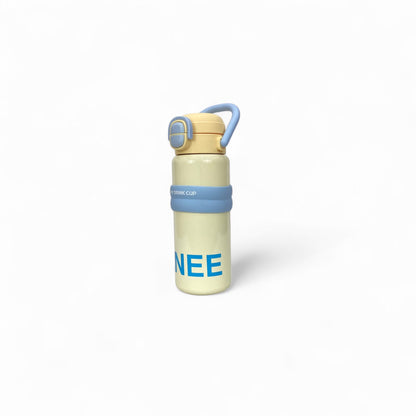 Kids stainless steel water bottle with cream body and blue handle, side angle, flip-top