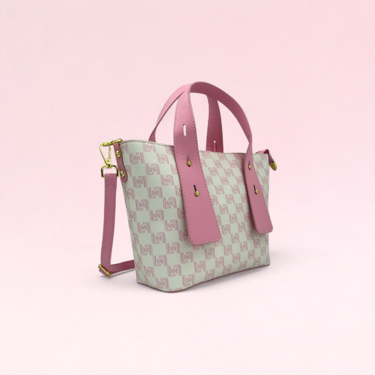 Pink geometric monogram tote bag with matching pouch and crossbody strap
