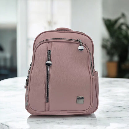 Dusty rose pebbled faux leather mini backpack, front vertical zip pocket and top handle