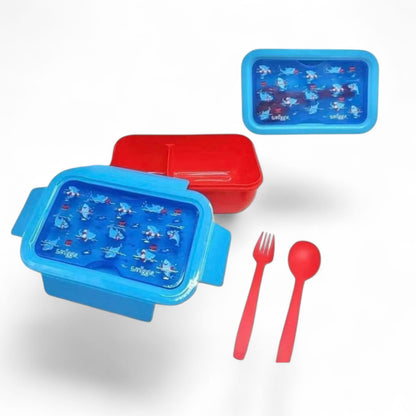 Two nested lunch boxes with blue graphic trays and red lids, with red fork and spoon