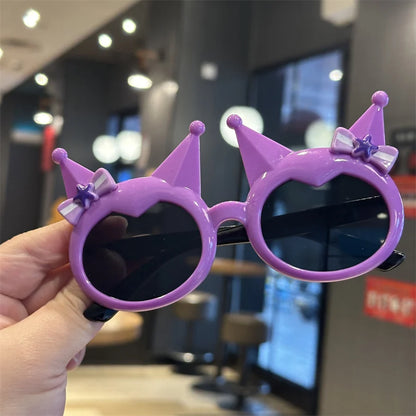 Kids' purple crown sunglasses with bow and star accents, dark round lenses