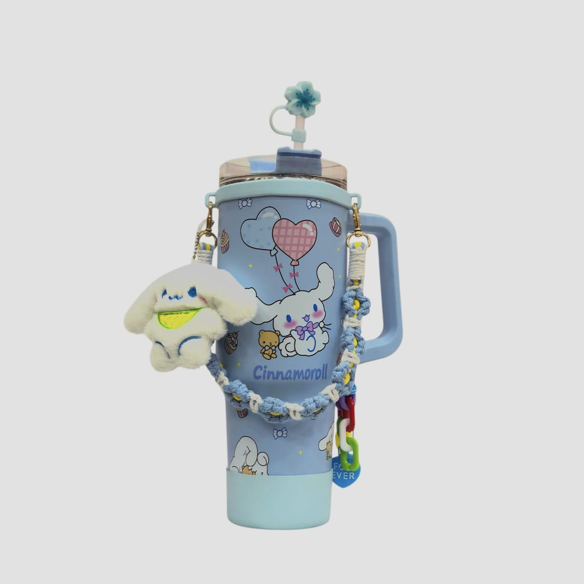 Light blue character tumbler with handle, heart balloon graphic, and plush charm