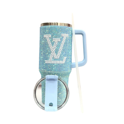 Light blue rhinestone LV tumbler with side handle, clear straw, and crystal top lid