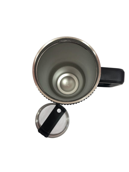 Black tumbler with stainless rim, open lid, and loop handle; underside view