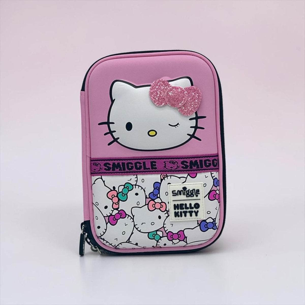 Pink zippered organizer with Hello Kitty face patch and glitter bow front