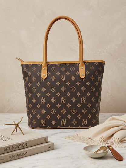 Brown monogram tote bag with repeating icons and tan leather handles