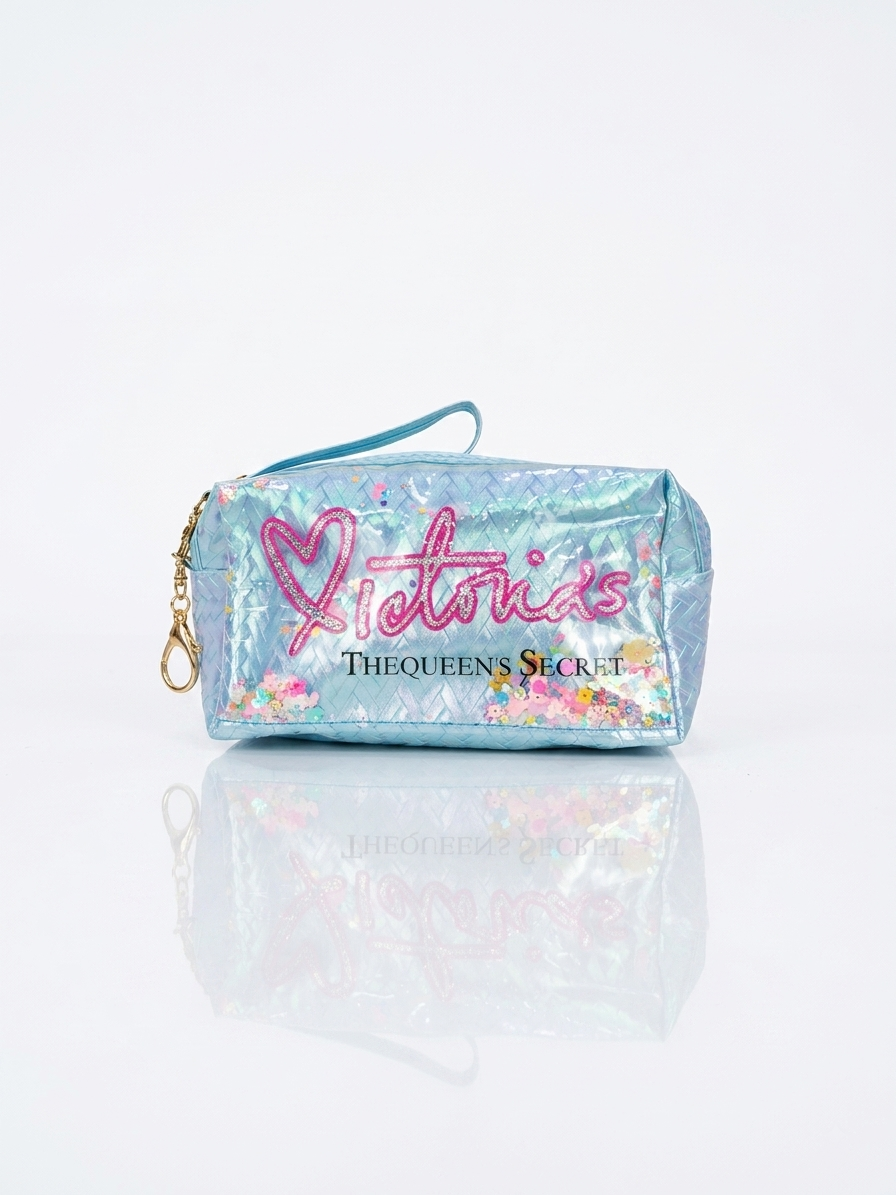 Iridescent woven makeup pouch in light blue with pink heart logo, top zipper and strap