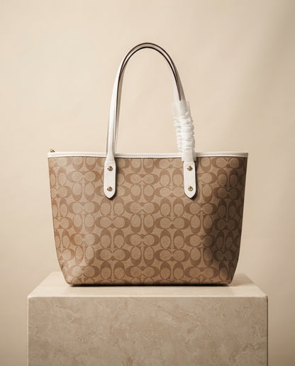Tan and cream monogram structured tote bag with white handles