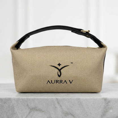 Beige canvas cosmetic pouch with black handle strap and gold AURRA V logo
