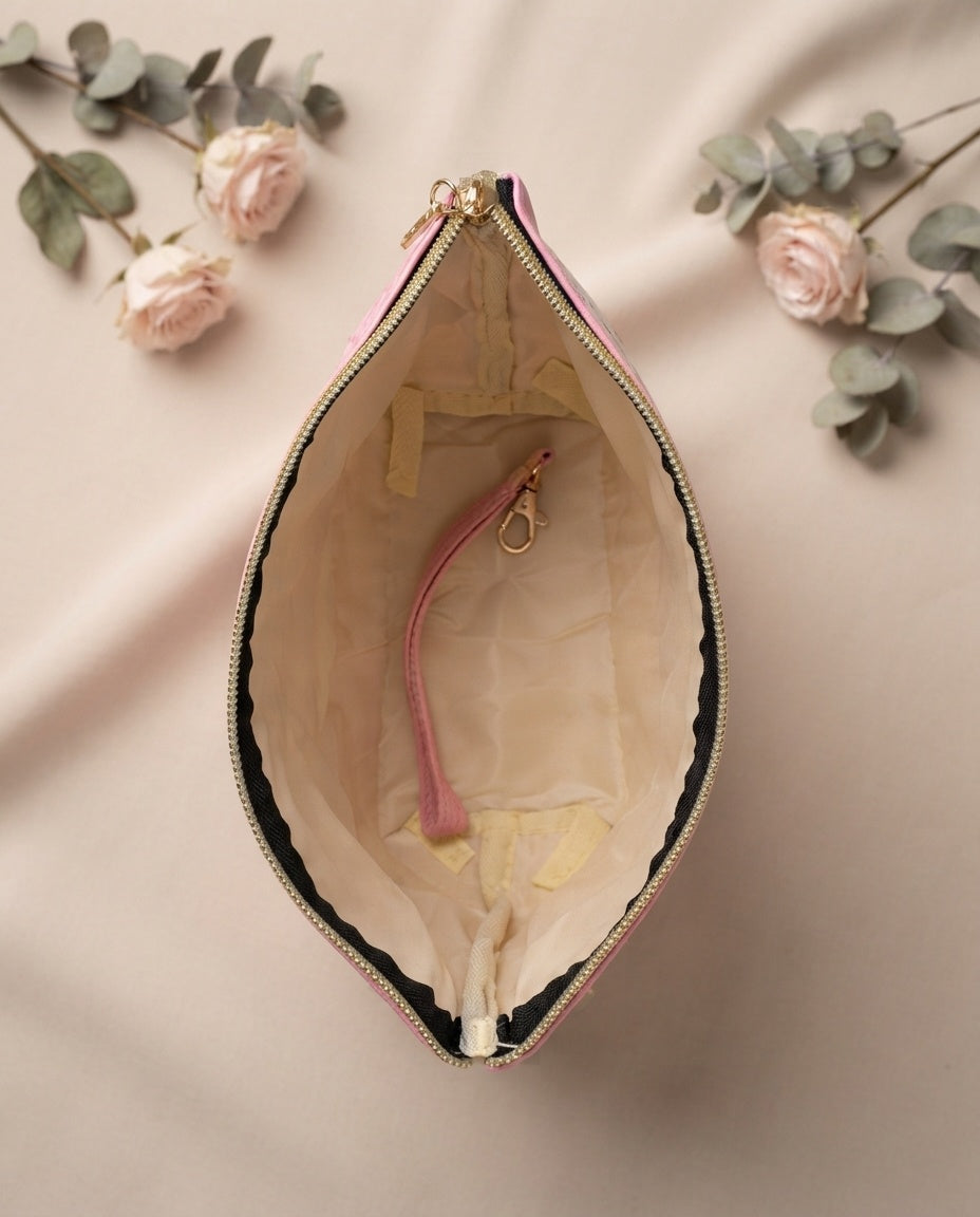 Open teardrop tweed cosmetic pouch with pink lining and zipper, leatherette trim