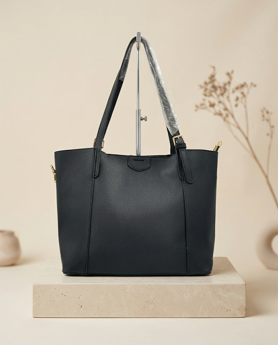 Dark navy structured faux leather tote bag with top handles and front seam panel