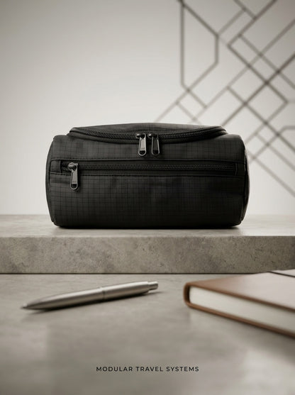 Black ripstop travel toiletry bag with top zipper, hanging loop, and front pocket