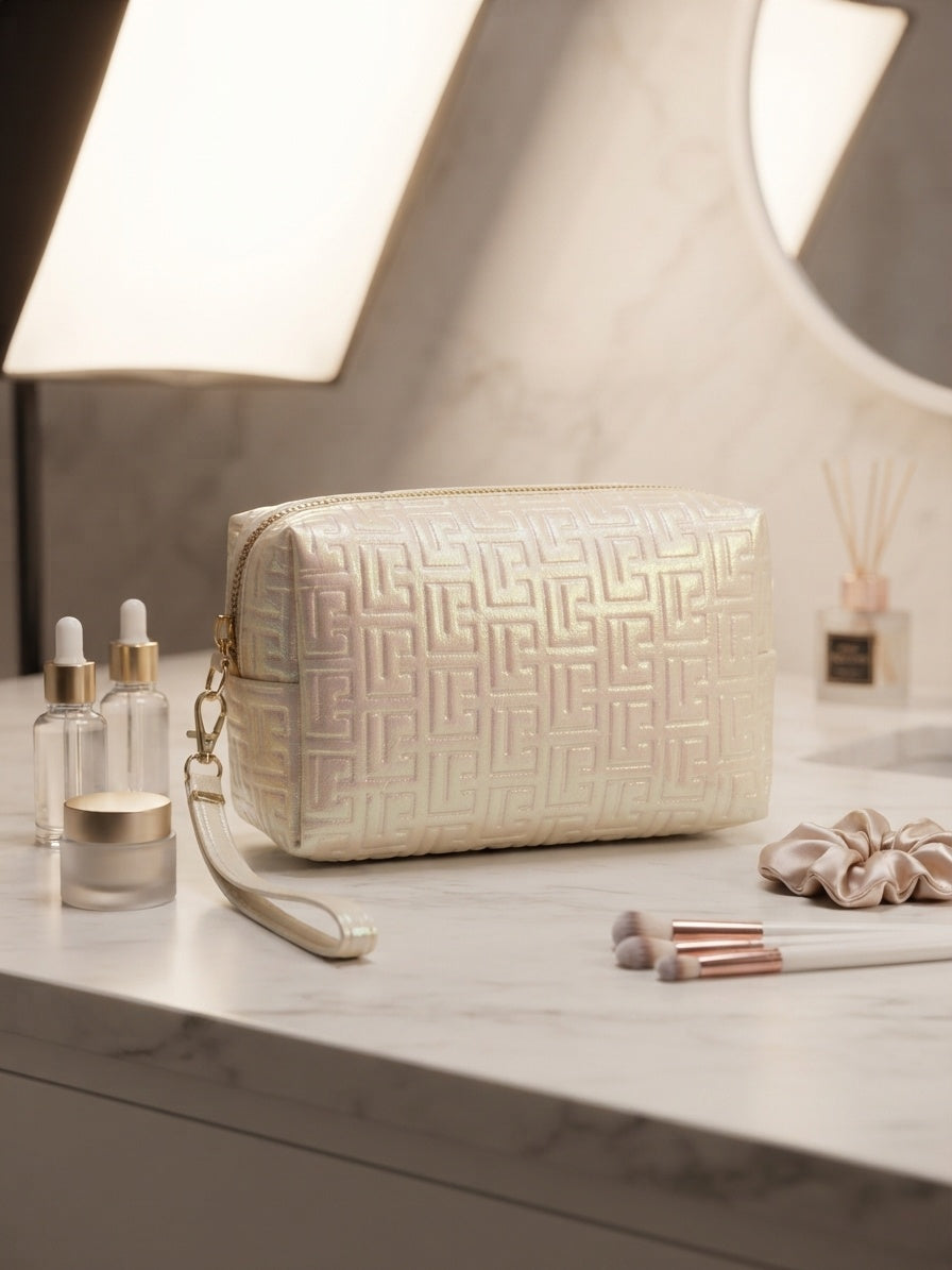 Iridescent geometric embossed cosmetic pouch with wristlet strap, light gold