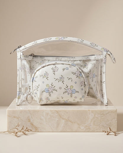 Clear dome cosmetic pouch with floral print, zip-top, and small inner pouch