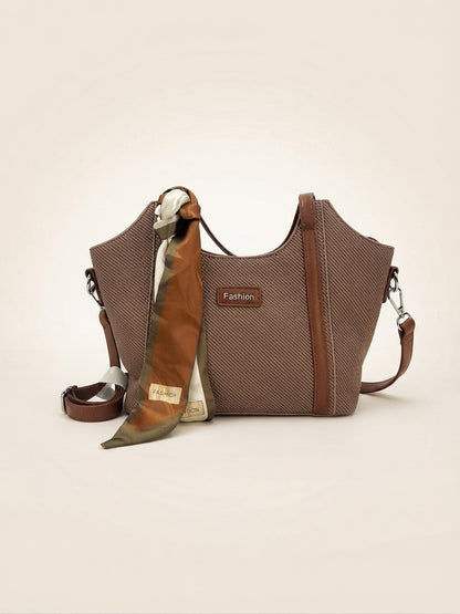 Brown textured structured top-handle tote with draped scarf and crossbody strap