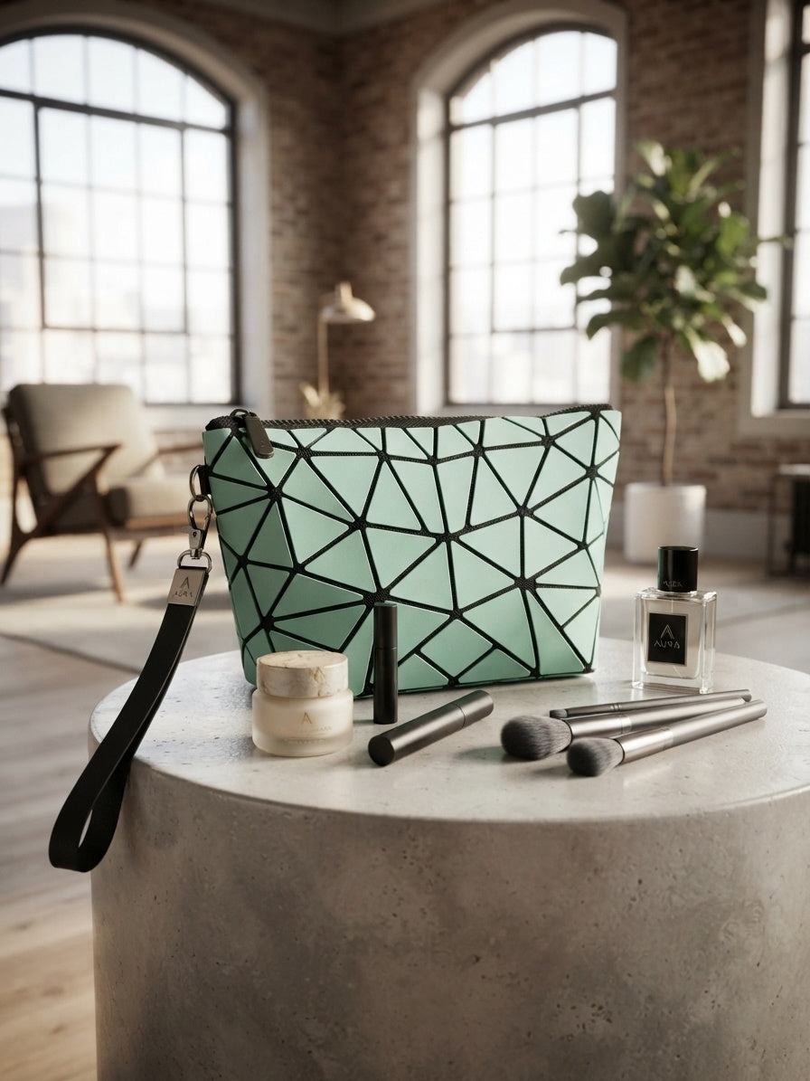Geometric origami clutch wristlet bag in green with black geometric pattern and wrist strap
