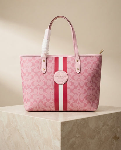 Pink monogram structured tote bag with center circle logo and red/white stripe