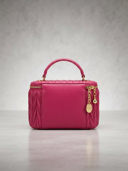miu miu matelassé leather vanity case in pink with top handle and gold zipper charms