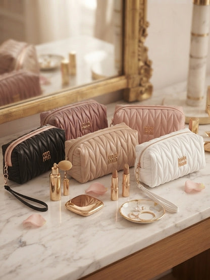 Quilted cosmetic pouch set with wristlet straps and gold logo, multiple colors