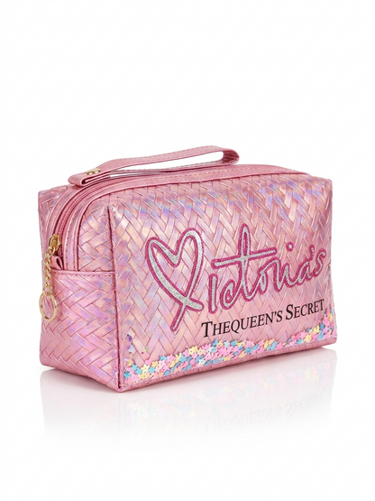 Iridescent woven makeup pouch in pale pink with heart logo, top zipper and carry handle