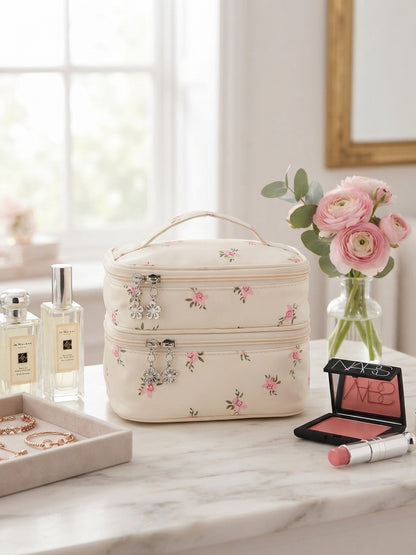Cream floral quilted double-layer cosmetic organizer bag with top handle and zip closure.