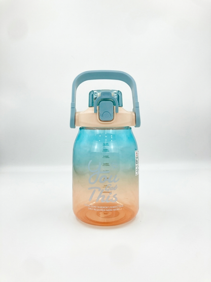 1L gradient water bottle in aqua and coral with flip lid and carry handle.