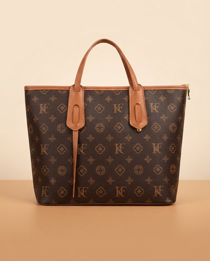 Monogram patterned structured tote bag with tan top handles and front pocket