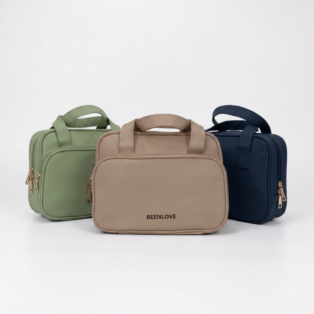 Set of travel vanity cases: beige, green, and navy, each with top handle and zipper.