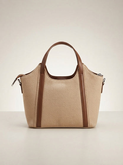 Beige textured structured top-handle bag with brown trim and side zipper pockets