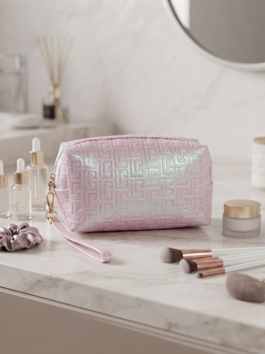 Iridescent geometric embossed cosmetic pouch with wristlet strap, pale pink