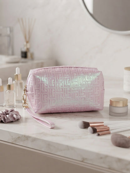 Iridescent geometric embossed cosmetic pouch with wristlet strap, pale pink