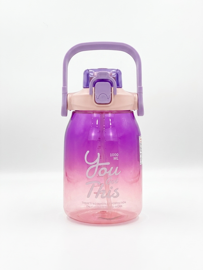 1L gradient water bottle in purple and pink with flip lid and carry handle.