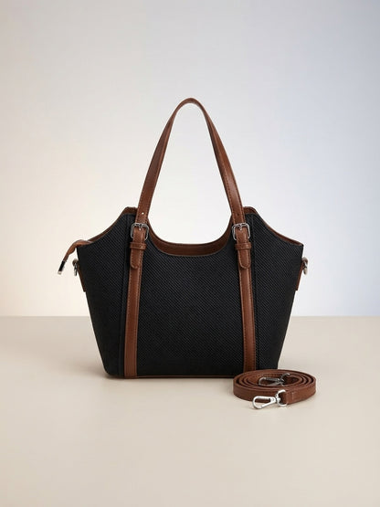 Black textured structured top-handle bag with brown trim and detachable crossbody strap