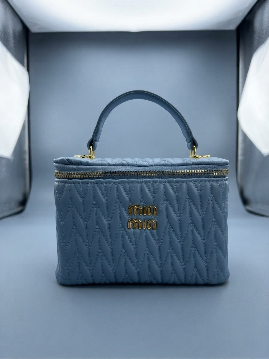 Miu Miu blue quilted leather vanity case with top handle