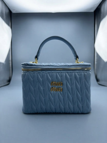 Miu Miu blue quilted leather vanity case with top handle