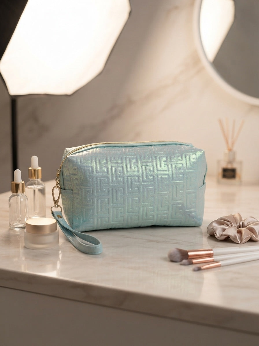 Iridescent geometric embossed cosmetic pouch with wristlet strap, aqua blue