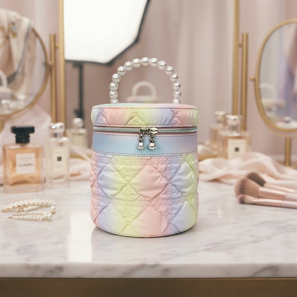Iridescent pastel quilted cylinder vanity bag with pearl bead handle and top clasp